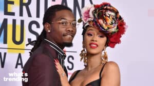 Rapper Offset in glasses and Cardi B in a floral headpiece and black dress at the American Music Awards