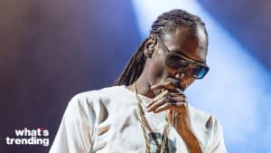 Snoop Dogg wearing sunglasses and a white shirt, holding a cigar, with "what's trending" text in the corner.