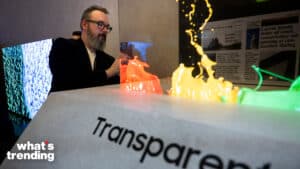 A person looks at a transparent micro led screen during the Samsung First Look preview at the Caesars Palace resort a pre-show for this weeks Consumer Electronics Show January 7, 2024, in Las Vegas, Nevada. (Photo by Brendan Smialowski / AFP) (Photo by BRENDAN SMIALOWSKI/AFP via Getty Images)