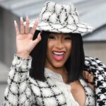 US rapper Cardi B waves as she arrives prior to the Chanel Women's Spring-Summer 2020 Ready-to-Wear collection fashion show at the Grand Palais in Paris, on October 1, 2019.