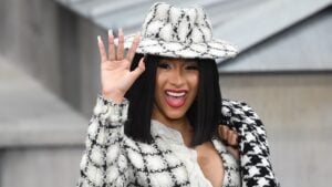 US rapper Cardi B waves as she arrives prior to the Chanel Women's Spring-Summer 2020 Ready-to-Wear collection fashion show at the Grand Palais in Paris, on October 1, 2019.