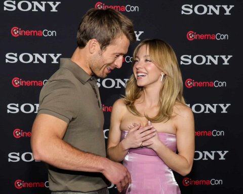 Glen Powell (L) and Sydney Sweeney promote the upcoming film "Anyone But You" at the Sony Pictures Entertainment presentation during CinemaCon, the official convention of the National Association of Theatre Owners, at The Colosseum at Caesars Palace on April 24, 2023 in Las Vegas, Nevada.