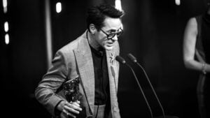 Image has been converted to black and white.) Robert Downey Jr. accepts the Supporting Actor Award for 'Oppenheimer' on stage during the EE BAFTA Film Awards 2024 at The Royal Festival Hall on February 18, 2024 in London, England.