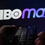 TV remote control is seen with HBO Max logo displayed on a screen in this illustration photo taken in Krakow, Poland on February 6, 2022.