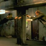 Keanu Reeves and Hugo Weaving face each other in a scene from Andy and Larry Wachowski's 1999 movie The Matrix. In this scene, Neo (Reeves) fights the computerized Agent Smith