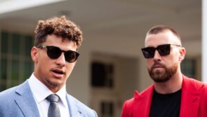 Kansas City Chiefs quarterback Patrick Mahomes (left) and tight end Travis Kelce speak to reporters following a White House celebration of the team's 2023 Super Bowl championship. In a long-standing White House tradition, President Joe Biden is hosting championship-winning teams in collegiate and professional sports.
