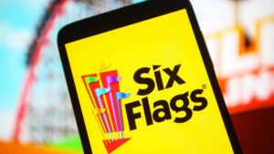 In this photo illustration the Six Flags Entertainment Corporation (Six Flags Theme Parks) logo is seen on a smartphone screen.