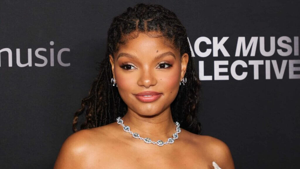 Chloe Bailey with braided hair and a silver necklace at the Black Music Collective event.