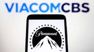 In this photo illustration, Paramount Pictures Corporation logo is seen on a smartphone screen with a ViacomCBS Inc. logo in the background.