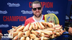Professional competitive eater Patrick Bertoletti consumes 58 hot dogs in 10 minutes to win the 2024 Nathan's Famous International Hot Dog Eating Contest at Coney Island on July 4, 2024 in New York City.
