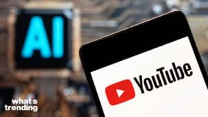 In this photo illustration, the American video-sharing website platform owned by Google, YouTube, logo seen displayed on a smartphone with an Artificial intelligence (AI) chip and symbol in the background.