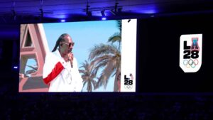 Rapper Snoop Dogg on the screen performing during the closing ceremony