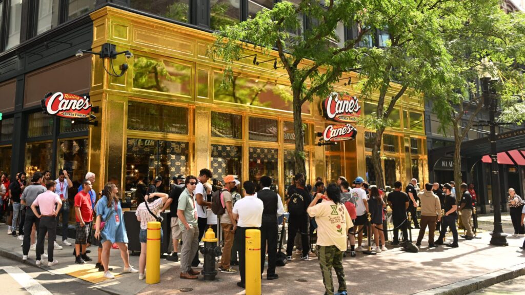 Fans attend Raising Cane's celebration "Golden Birthday" with the opening of the new Gold restaurant on August 28, 2024 in Boston, Massachusetts.