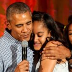 US President Barack Obama hugs his daughter Malia, after singing to her Happy Birthday, at the Fourth of July White House party, while singer Janelle Monáe (R) and singer Kendrick Lamar (L) react, on July 4, 2016, Washington, DC, USA, in the East room of the White House. Malia was born 18 years ago. Guests at the party included military families and staff and their families from throughout the administration. Because of the rain the party was moved from the South Lawn to the East Room of the White House.