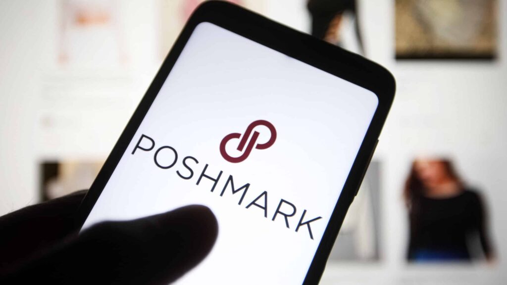 In this photo illustration, a Poshmark Inc. logo is seen on a smartphone screen in front of its website.