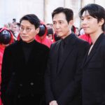 Lucca, The photocall for the press conference of season 2 of the Netflix series Squid Game at Lucca Comics & Games. In the photo: Creator, writer and director Hwang Dong-hyuk and the protagonists Lee Jung-jae and Wi Ha-Jun