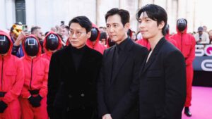 Lucca, The photocall for the press conference of season 2 of the Netflix series Squid Game at Lucca Comics & Games. In the photo: Creator, writer and director Hwang Dong-hyuk and the protagonists Lee Jung-jae and Wi Ha-Jun