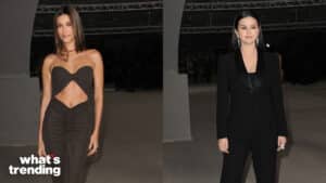 Hailey Bieber in a black cut-out dress and Selena Gomez in a black suit at a formal event.