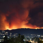 The Palisades fire explodes looking like a volcano in the Santa Monica mountains into the San Fernando Valley causing evacuations Friday, Van Nuys