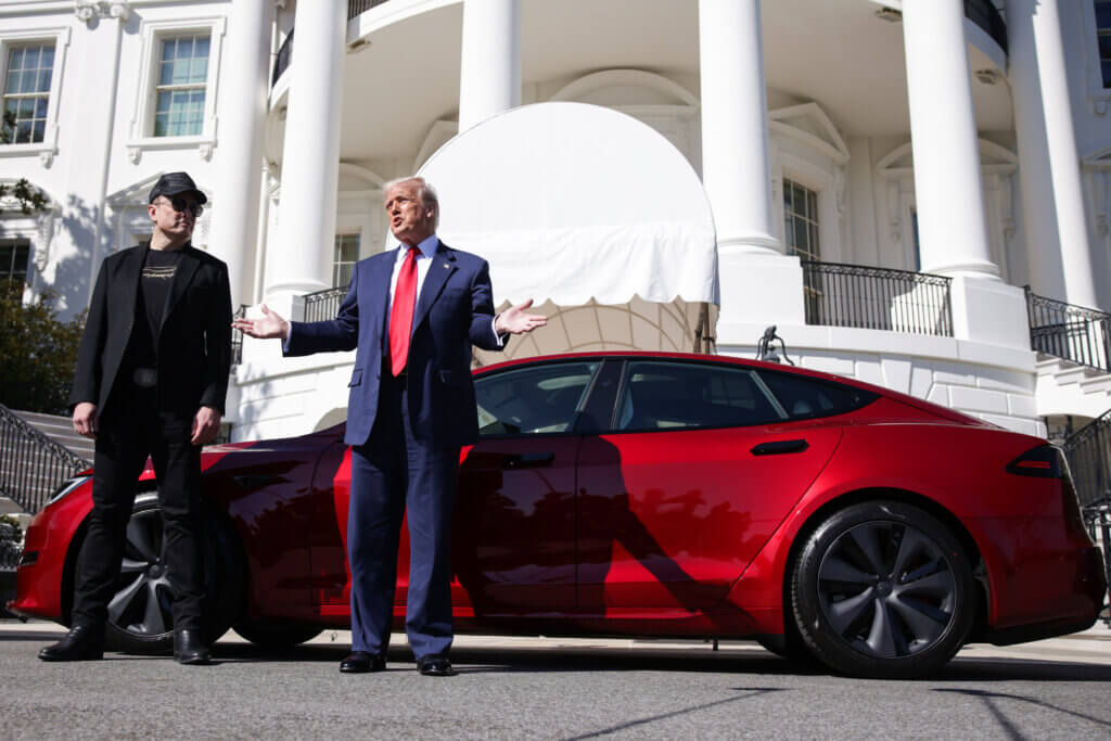 Elon Musk, Tesla CEO and Senior Advisor to the President of the United States, looks on as President Donald Trump speaks in front of Tesla vehicles at the White House in Washington, DC on March 11, 2025. President Trump has said he will buy a Tesla to support Tesla and Elon Musk after recent attacks on Tesla charging stations and calls for boycotts of Tesla products.