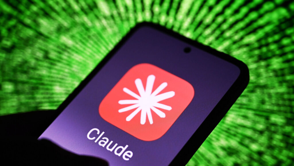 Smartphone screen displaying the Claude app icon with a red background and white starburst logo against a green digital background