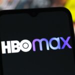 In this photo illustration, the HBO Max logo is seen displayed on a smartphone screen.