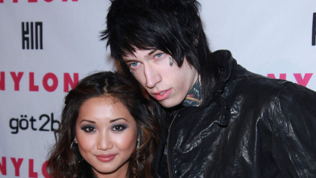 Brenda Song and Trace Cyrus posing together at a Nylon magazine event.