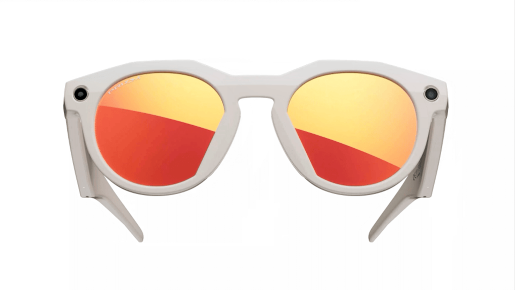 White-framed Oakley sunglasses with orange-red mirrored Prizm lenses and built-in cameras on each side