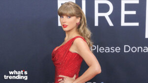 Taylor Swift in a red sequined dress posing at a formal event with a dark backdrop and "what's trending" logo.