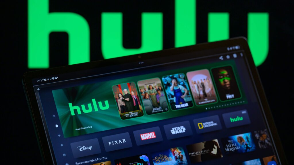 Hulu streaming app interface on a tablet with Disney, Pixar, Marvel, Star Wars, and National Geographic categories visible.