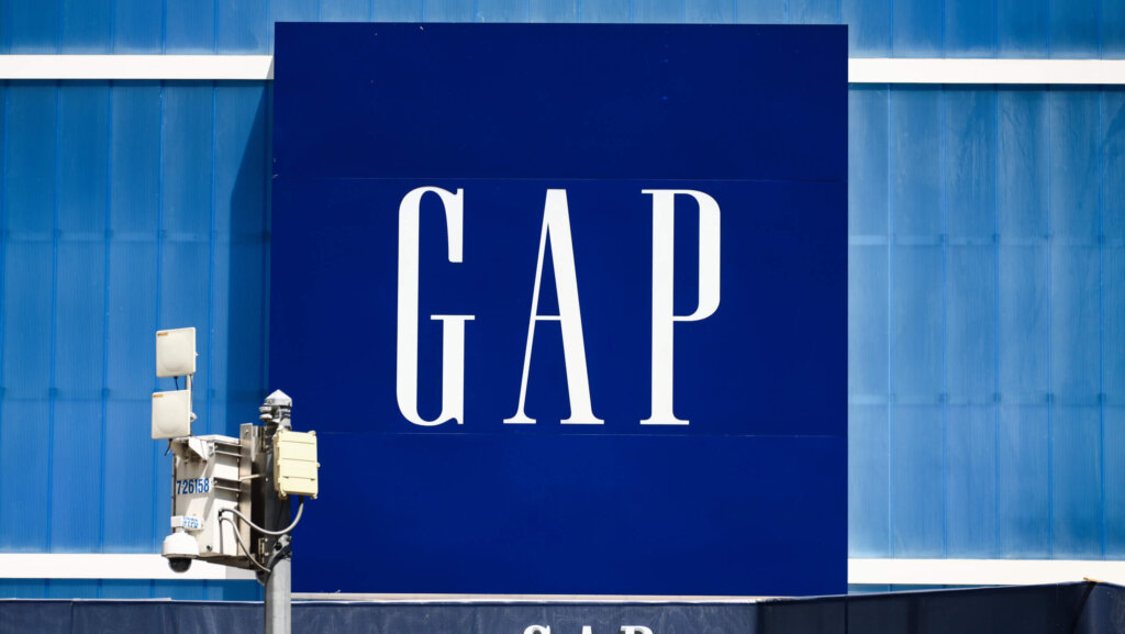 GAP logo on a large blue storefront sign with security cameras in front