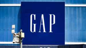 GAP logo on a large blue storefront sign with security cameras in front