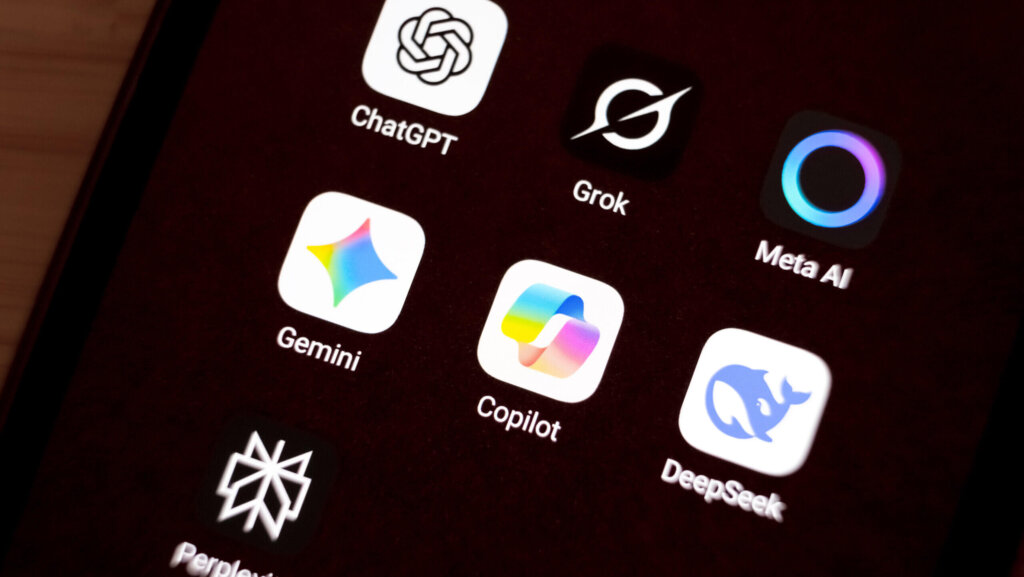 Smartphone screen showing AI app icons including ChatGPT, Grok, Meta AI, Gemini, Copilot, DeepSeek, and Perplexity.