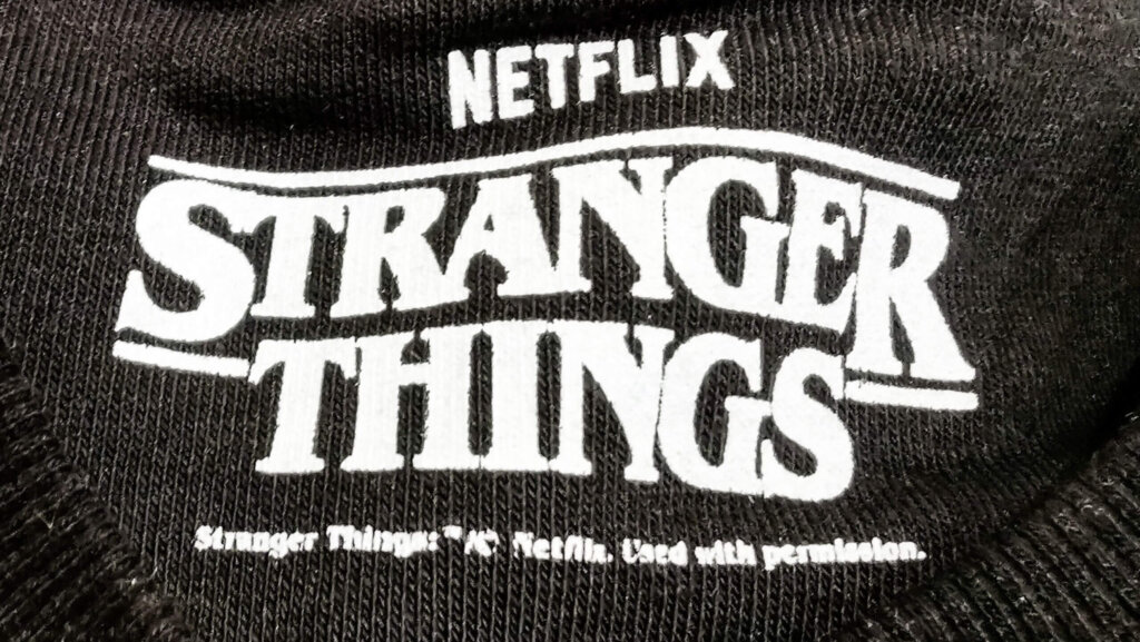 Netflix Stranger Things logo printed on black fabric