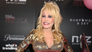 Dolly Parton wearing a gold sequined dress at Dolly Parton's Pet Gala event backdrop
