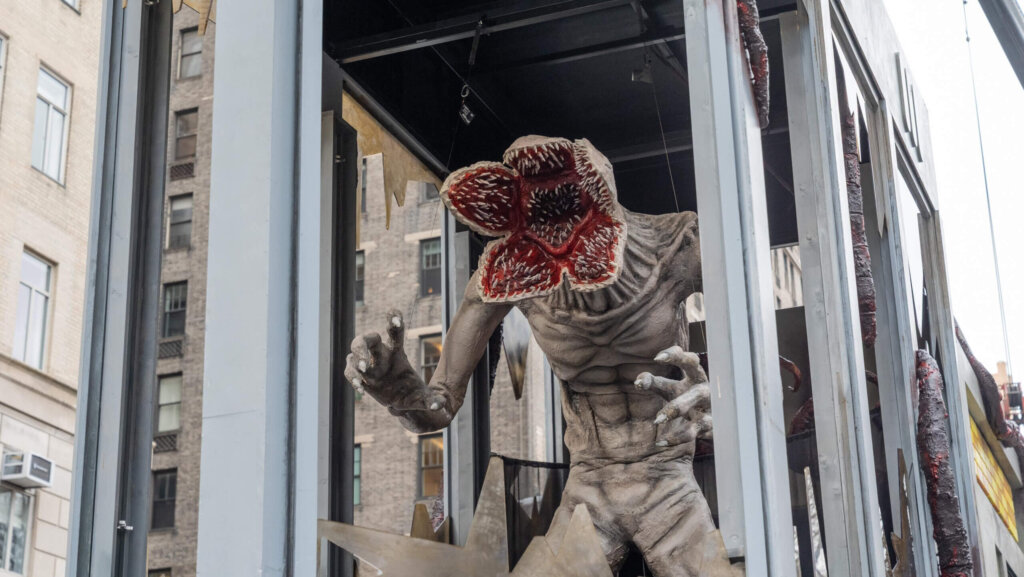 Demogorgon monster figure from Stranger Things displayed in a city street installation