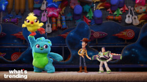 Ducky and Bunny holding a yellow chick, with Woody and Buzz Lightyear from Toy Story in a carnival game setting