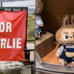 Red banner with white text "FOR CHARLIE" next to a plush toy with a furry hood and blue overalls sitting on a wooden shelf