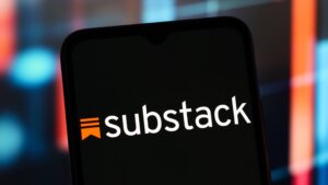 Substack logo displayed on a smartphone screen with a blurred colorful background