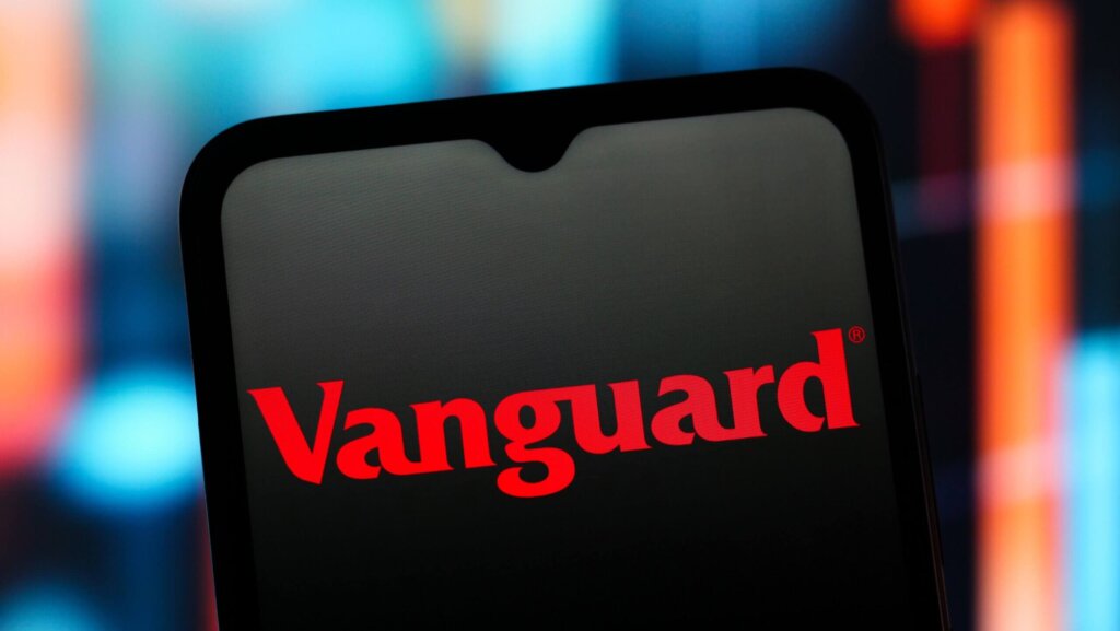 Vanguard logo displayed on a smartphone screen with a blurred colorful background