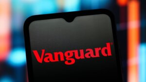 Vanguard logo displayed on a smartphone screen with a blurred colorful background