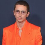 Timothée Chalamet and masked British rapper EsDeeKid released a music video to debunk rumors, but fans suspect a body double proves the rap conspiracy is still alive.