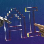 Robot hand and human hand reaching toward transparent letters "AI" on a blue circuit board background