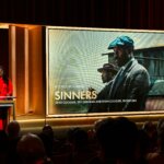Presenters announcing the Best Picture nominee "Sinners" at the Oscars ceremony.