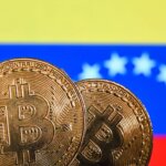 Two Bitcoin coins in front of the Venezuelan flag with yellow, blue, and red stripes and white stars