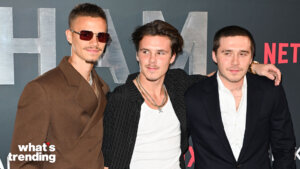 Romeo Beckham, Cruz Beckham and Brooklyn Beckham posing together at a Netflix event.