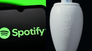 Spotify logo on a smartphone screen next to a white urn with the Spotify logo embossed on it