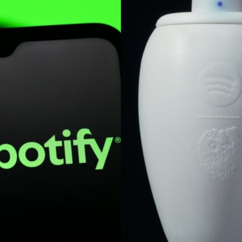 Spotify logo on a smartphone screen next to a white urn with the Spotify logo embossed on it