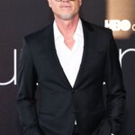 Eric Dane wearing a black suit and glasses at an HBO event.