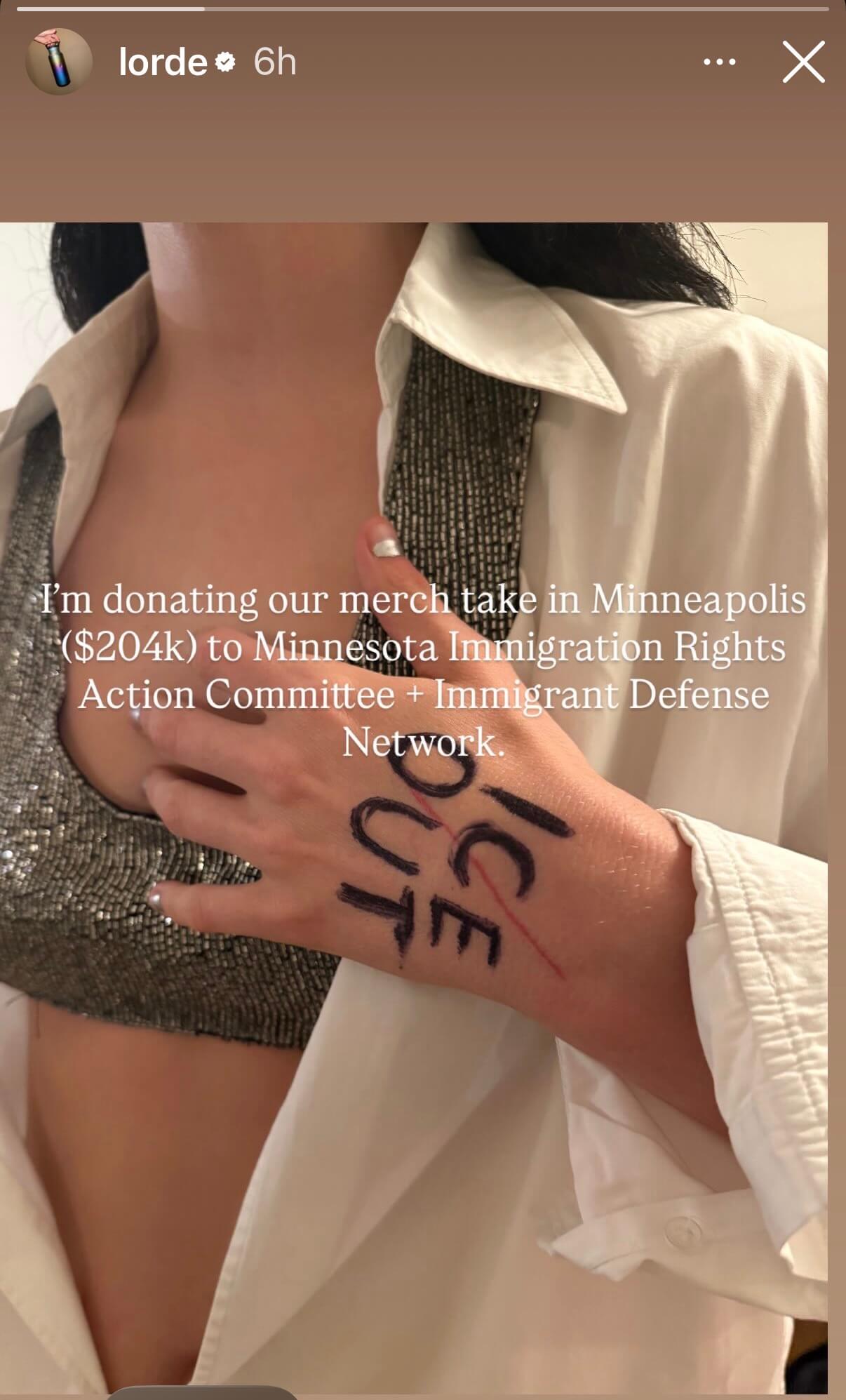 Lorde wearing a white shirt and silver top with "ICE OUT" written on her hand, announcing a $204k merch donation to immigration rights groups.